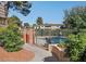 Community pool area with a paved pathway, shade trees, and comfortable seating at 778 Oakmont Ave # 312, Las Vegas, NV 89109