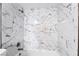 Modern shower showcasing stylish marble tile work, and updated fixtures at 778 Oakmont Ave # 312, Las Vegas, NV 89109