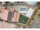 Expansive backyard featuring a sparkling pool and spa, a sport court, playground and privacy landscaping at 7825 Alameda Creek St, Las Vegas, NV 89113