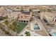 Gorgeous backyard featuring a sparkling pool and spa, a sport court, artificial grass and a patio at 7825 Alameda Creek St, Las Vegas, NV 89113
