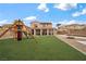 Beautiful backyard with an artificial turf lawn and play structure at 7825 Alameda Creek St, Las Vegas, NV 89113