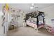 This bedroom is decorated with flowers and features a window at 7825 Alameda Creek St, Las Vegas, NV 89113