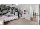 This bedroom features an archway to the hallway and a window at 7825 Alameda Creek St, Las Vegas, NV 89113