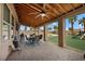Spacious covered patio with ceiling fans, outdoor seating, a grill, and a view of the backyard at 7825 Alameda Creek St, Las Vegas, NV 89113
