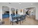 Open dining area with staircase access, complemented by natural light through multiple windows at 7825 Alameda Creek St, Las Vegas, NV 89113