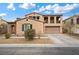 Charming two-story home with a tile roof, balcony, desert landscaping, and a two-car garage at 7825 Alameda Creek St, Las Vegas, NV 89113