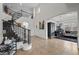 Welcoming foyer featuring a gracefully curved staircase and open access to the living area at 7825 Alameda Creek St, Las Vegas, NV 89113