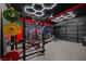 Finished home gym with honeycomb LED lighting, weight racks, and mirrored wall at 7825 Alameda Creek St, Las Vegas, NV 89113