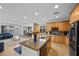 Open-concept kitchen with an island overlooking the living area; great for entertaining friends and Gathering at 7825 Alameda Creek St, Las Vegas, NV 89113