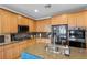 Well-equipped kitchen featuring stainless steel appliances, a granite island, and ample cabinet space at 7825 Alameda Creek St, Las Vegas, NV 89113
