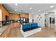 Gourmet kitchen with a granite island, light wood cabinetry, and stainless steel appliances at 7825 Alameda Creek St, Las Vegas, NV 89113