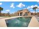 This backyard features a swimming pool and a play structure at 7825 Alameda Creek St, Las Vegas, NV 89113