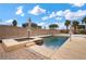 Beautiful pool and spa area surrounded by a patio and mature landscaping at 7825 Alameda Creek St, Las Vegas, NV 89113