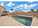 This backyard features a swimming pool and artificial turf at 7825 Alameda Creek St, Las Vegas, NV 89113