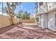 Private backyard featuring brick patio, gravel landscaping and a tall privacy wall at 92 Sea Holly Way, Henderson, NV 89074