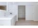 Bathroom featuring double sinks with closet through sliding door at 92 Sea Holly Way, Henderson, NV 89074