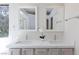 Bright bathroom featuring double sinks, quartz counters and sleek fixtures at 92 Sea Holly Way, Henderson, NV 89074
