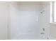 Bathroom with a white tub and shower combo with tile at 92 Sea Holly Way, Henderson, NV 89074