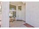 Covered home entrance featuring a sitting area and large windows at 92 Sea Holly Way, Henderson, NV 89074