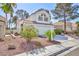 Attractive two-story home featuring a two-car garage and desert landscaping at 92 Sea Holly Way, Henderson, NV 89074
