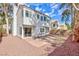 Two-story home with a well-maintained backyard, sliding glass door, and an inviting outdoor patio at 92 Sea Holly Way, Henderson, NV 89074