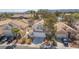 Charming home with a well-maintained front yard, lush landscaping, and a two-car garage at 92 Sea Holly Way, Henderson, NV 89074