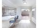 Eat-in kitchen featuring counter seating, stainless appliances, and bright, natural light at 92 Sea Holly Way, Henderson, NV 89074