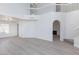 Spacious living room with neutral paint, high ceilings and carpeted stairs at 92 Sea Holly Way, Henderson, NV 89074