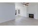 Bright living room featuring a fireplace and sliding door to the backyard at 92 Sea Holly Way, Henderson, NV 89074