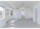Spacious, bright main bedroom with plush carpeting, a ceiling fan, and an en-suite bathroom at 92 Sea Holly Way, Henderson, NV 89074