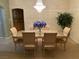 Elegant dining room with chandelier lighting and a decorative dining table at 9301 Harrow Rock St, Las Vegas, NV 89143