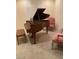 Sitting room featuring piano, and a pair of pink chairs at 9301 Harrow Rock St, Las Vegas, NV 89143