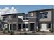 Modern townhome featuring a two-tone color scheme and stylish front yard landscaping at 9451 Calm Stream Ave # Lot 81, Las Vegas, NV 89178