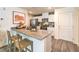 Bright kitchen featuring quartz counters, stainless steel appliances, and modern cabinetry at 9451 Calm Stream Ave # Lot 81, Las Vegas, NV 89178