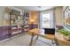 Well-lit office space featuring modern shelving, a sleek desk, and neutral decor for a productive and comfortable work environment at 9451 Calm Stream Ave # Lot 81, Las Vegas, NV 89178