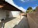 Backyard showcasing ample space, concrete floors, covered patio, and security doors at , Las Vegas, NV 89106