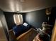 Bedroom with dark accent wall, hardwood floors, and a bright window at , Las Vegas, NV 89106