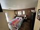 Cozy bedroom featuring an accent wall, hardwood floors and plenty of natural light at , Las Vegas, NV 89106