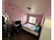 A small bedroom with a pink painted themed and decorated with star and heart stickers at , Las Vegas, NV 89106