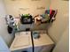 Functional laundry room with a washer, a dryer, and storage shelves at , Las Vegas, NV 89106