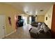 Cozy living room featuring tile floors, neutral walls, and a comfortable sectional sofa at , Las Vegas, NV 89106
