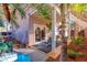 Backyard featuring a cozy covered patio, tropical foliage, and a small plunge pool at 101 Morning Dr, Henderson, NV 89012