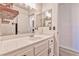 Clean bathroom features a white vanity, and well-lit mirror, creating a fresh and inviting space at 101 Morning Dr, Henderson, NV 89012