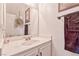 Clean and simple bathroom featuring a vanity with a sink and a large mirror at 101 Morning Dr, Henderson, NV 89012