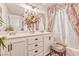 Bathroom features double sinks, stylish vanity, floral arrangement, and shower/tub at 101 Morning Dr, Henderson, NV 89012
