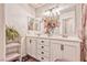 Bright bathroom with double vanity, decorative flowers, and stylish accents at 101 Morning Dr, Henderson, NV 89012