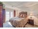 Bedroom featuring a king bed, side tables, and patio access at 101 Morning Dr, Henderson, NV 89012