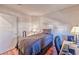 Simple bedroom with wood floors and a bed, with a desk and chair for a workspace at 101 Morning Dr, Henderson, NV 89012
