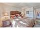 Bedroom boasts a large bed, decorative pillows, and two bedside lamps at 101 Morning Dr, Henderson, NV 89012