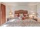 Bedroom view highlights bed with decorative pillows and two bedside lamps at 101 Morning Dr, Henderson, NV 89012